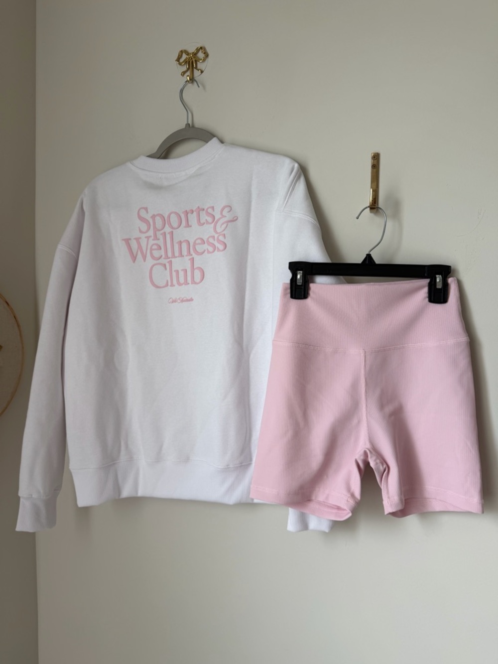 white and pink crewneck and biker shorts two piece work out set